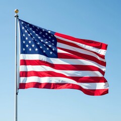 Fototapeta premium American flag waving on silver pole against clear blue sky for patriotic marketing campaigns and corporate branding with copy space for text