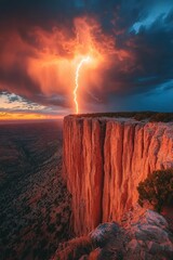 Lightning strikes cliff; fiery sunset landscape.