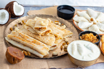 Pitha Pulli is a traditional Bengali sweet made with rice flour, jaggery, coconut, and spices, often steamed or fried.