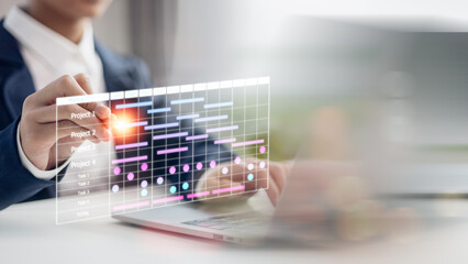 The project manager works and updates tasks with milestones and progress planning. Businessman draw Gantt chart scheduling virtual diagram, project management concept