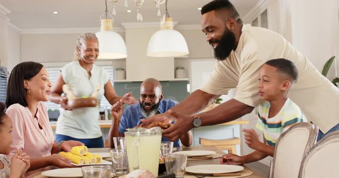 A diverse family gathered around dining table, smiling and interacting