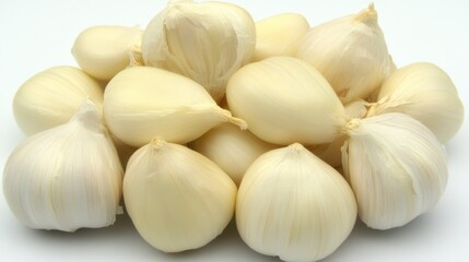 Close-up of a pile of fresh garlic cloves.