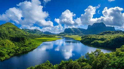 Obraz premium Serene River Winding Through Lush Green Mountainscape