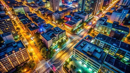 Aerial View of City Street at Night - Illuminated Buildings and Traffic