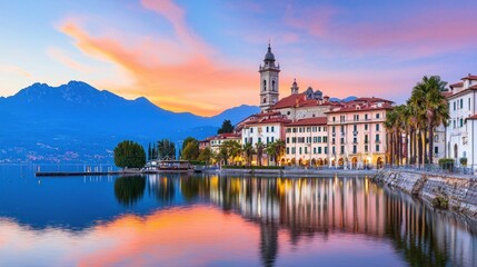 Fototapeta premium Serene lakeside view at sunset with mountains in the background.