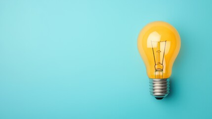 Bright Yellow Light Bulb on Blue Background for Creative Ideas
