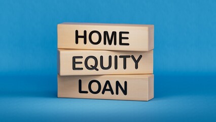 home Equity loan Word Written In Wooden Cube. Close up. Wooden cube blocks. Copy space.3D rendering on blue background.