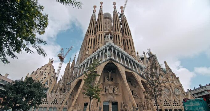 Discovering the Majestic Architecture of La Sagrada Familia in Barcelona Iconic Tourist Cathedral in Spain Catalonia Region. High quality 4k footage
