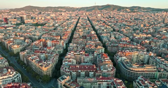 Aerial view sunrise cityscape in Barcelona. Morning urban landscape architecture of tourist city in Catalonia Spain. High quality 4k footage