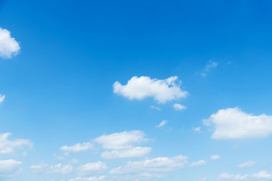 Background of blue sky with some white clouds