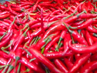 Red hot chilli peppers pattern texture background. Close up. Landscape. A backdrop ofRed hot chilli peppers. Street vegetable market. Group of Red hot chilli peppers. close up