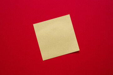 Top view of yellow sticky note paper on blue background
