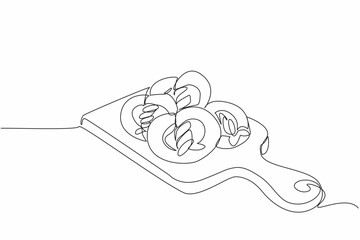 Single one line drawing pretzels are stacked on a thick wooden cutting board. Fresh from the oven. Cool before wrapping. Delicious. National Pretzel Day. Continuous line design graphic illustration