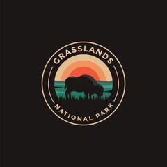 Grasslands National Park vector logo theme on dark background © DOMHOUZE