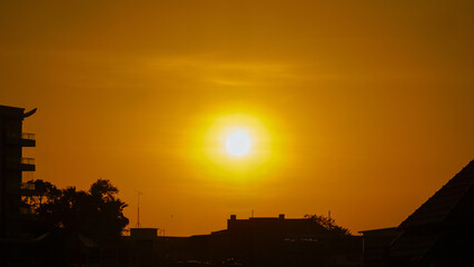 Landscape of sunset in the city.a city with golden hues of sunset in the background.