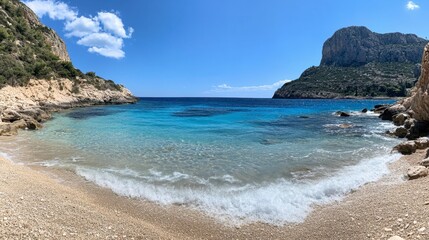A peaceful view of Karamitsi Beach with gentle waves and a clear, azure sky.