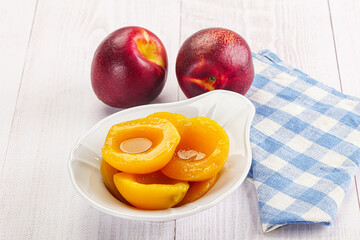Canned peaches with sweet syrope