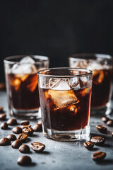 Three glasses of refreshing iced coffee with shimmering ice cubes are surrounded by scattered coffee beans on a textured surface.