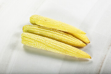 Raw sweet baby corn heap