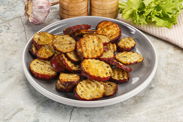 Baked red batat slices with herbs