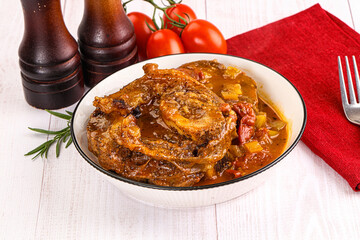 Italian cuisine - ossobuco with sauce
