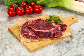 Raw beef cheeks cut for cooking