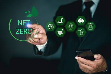 Businessman touching Net Zero icon. natural environment A climate-neutral long-term strategy greenhouse gas emissions targets. concept of carbon neutral and net zero.