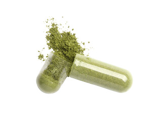 Green powder capsule pill isolated on white background. Top view. Flat lay.