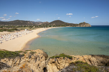 Pula, Italy - 09-10-2024: Beautiful beach in Chia, in Southern Sardinia, with white sand and transparent and turquoise water