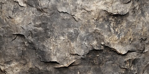 Naklejka premium Rugged grunge texture of rough stone in shades of gray and beige with uneven surfaces and depth, resembling a rocky mountain wall