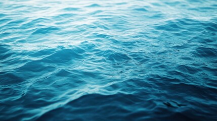 Obraz premium Gentle waves ripple across a calm turquoise sea on a sunny day