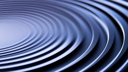 Abstract image of concentric ripples in blue tones, creating a serene visual effect.