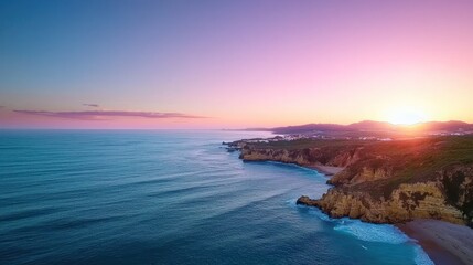 Obraz premium Pink and Purple Sunset over Ocean Coast