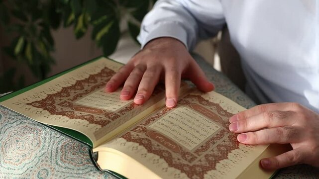 Muslim praying quran home