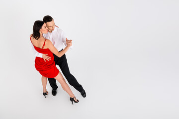 Obraz premium Full size high angle view photo of two young passionate dancing partners empty space ad isolated on white color background