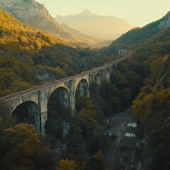 Stone Railway Viaduct Through Mountain Valley