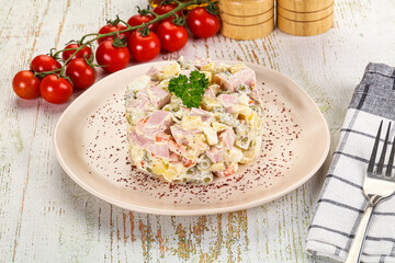 Russian traditional Olivier salad with sausages