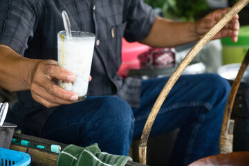 A Vendor Preparing Es Dawet, an Indonesian Traditional Drink Made from Starch, Coconut Milk and Palm Sugar