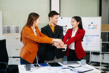 Office colleagues have a casual discussion. During a meeting in a conference room, a group of business teem