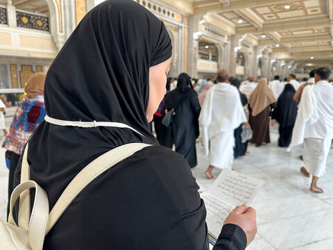A female pilgrim performs Umrah, walks between Safa and Marwa and reads prayers in the Sacred Mosque of Al Haram in Mecca.