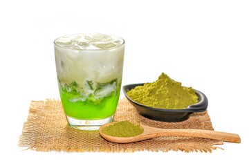 Pictures ice green tea mix with jelly cream and green tea matcha powder , spoon wooden serving on sack in white background and isolate concept.