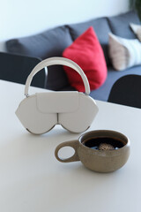 Morning Coffee, Headphones, and Newspaper in a Modern Kitchen