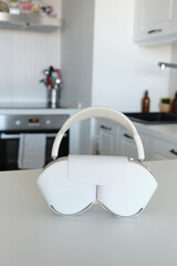 Modern White Headphones on Kitchen Counter