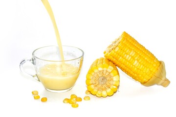Pouring sweet corn milk and serving on white background and isolate style.