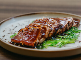 Tuna tataki with wakame and teriyaki sauce in luxury restaurant