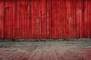 horizontal image of a red painted textured wooden fence background