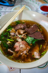 Famous Thai - Chinese Food - Clear Soup with congealed pork blood 
and minced pork together with streamed rice