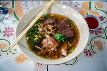 Famous Thai - Chinese Food - Clear Soup with congealed pork blood 
and minced pork together with streamed rice