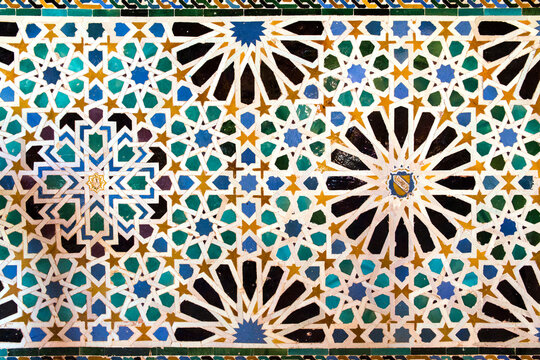 Moorish decoration on a wall of the Alhambra located in Granada, Spain.