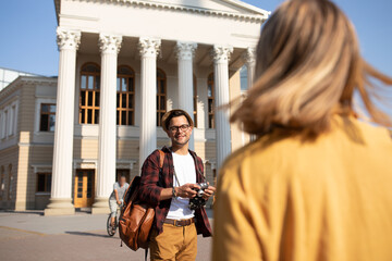 Couple of tourists having beautiful day. Making photos